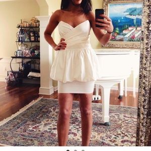 Creamy white peplum sweetheart cocktail dress